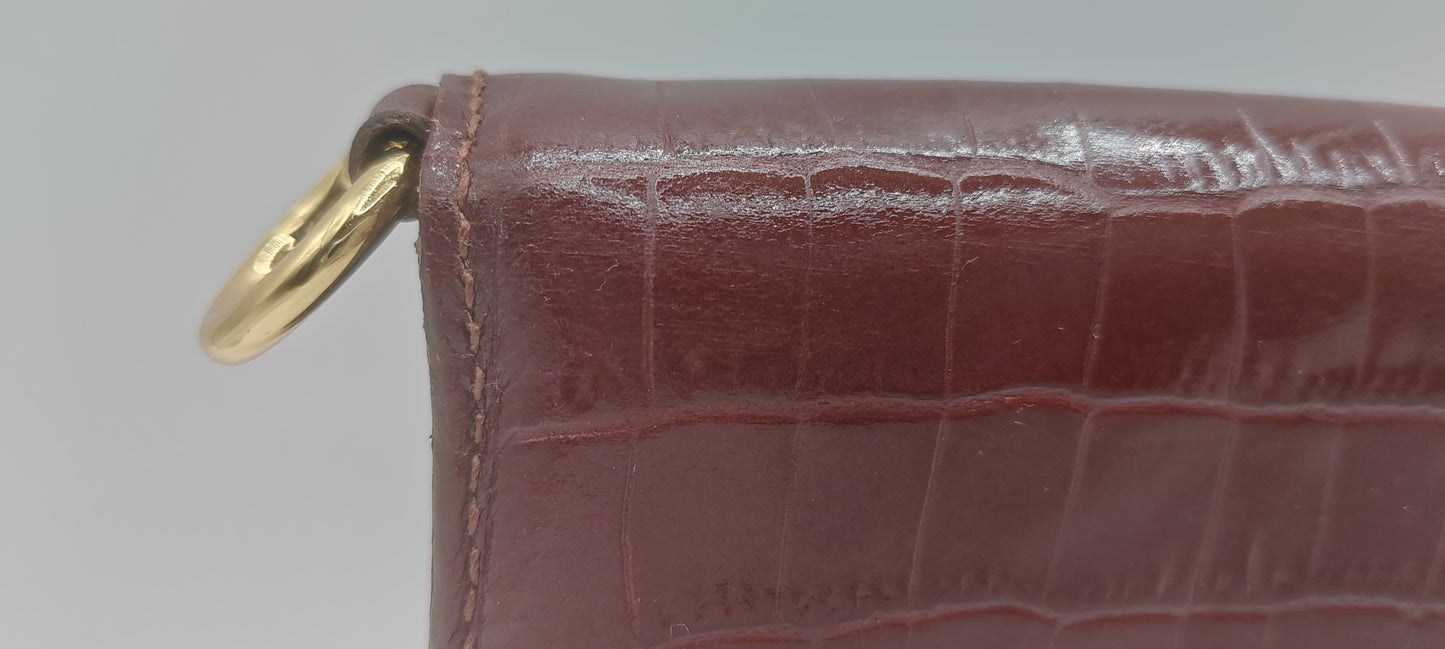 Le portefeuille cognac en cuir imprimé crocodile