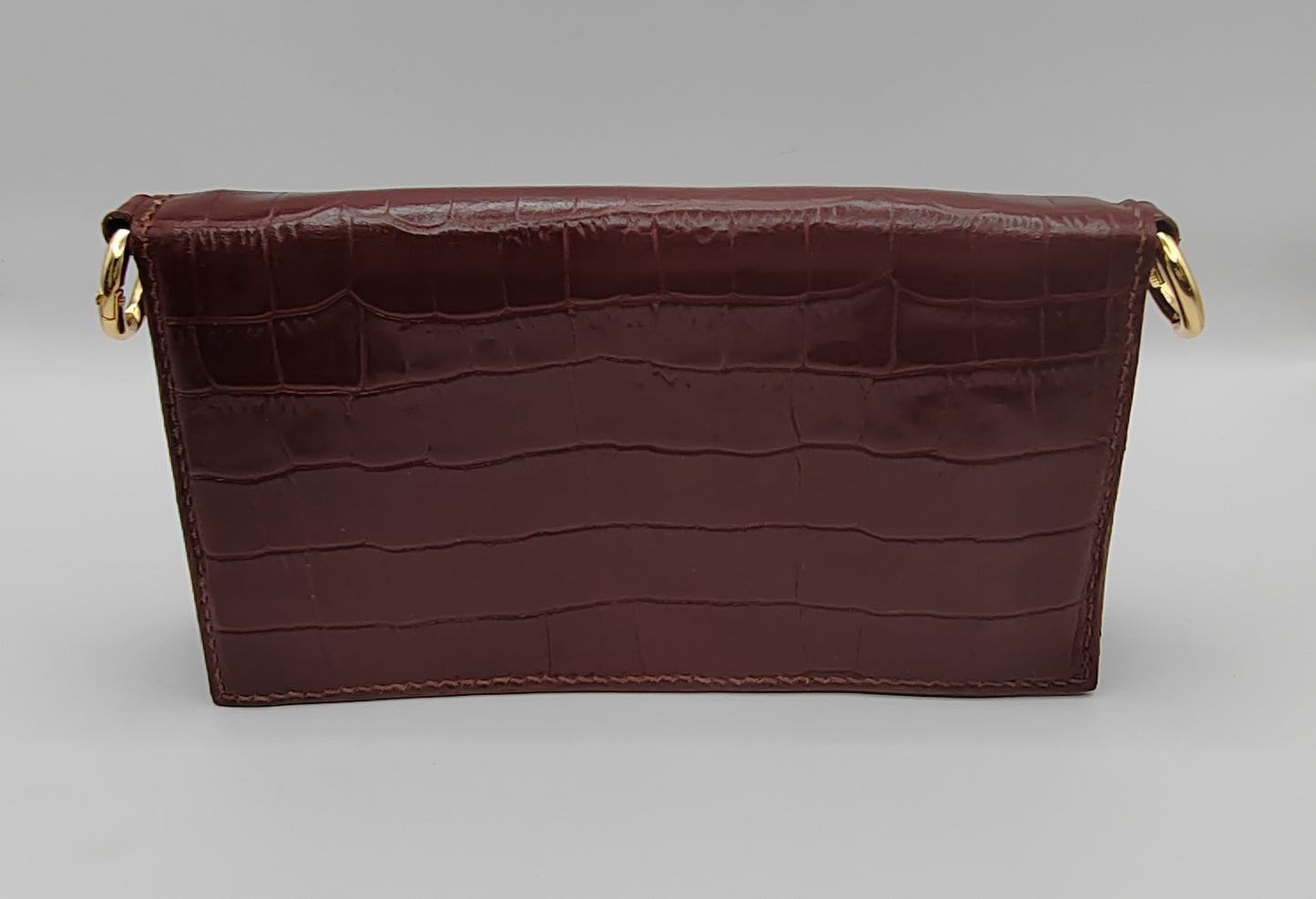 Le portefeuille noir en cuir imprimé crocodile